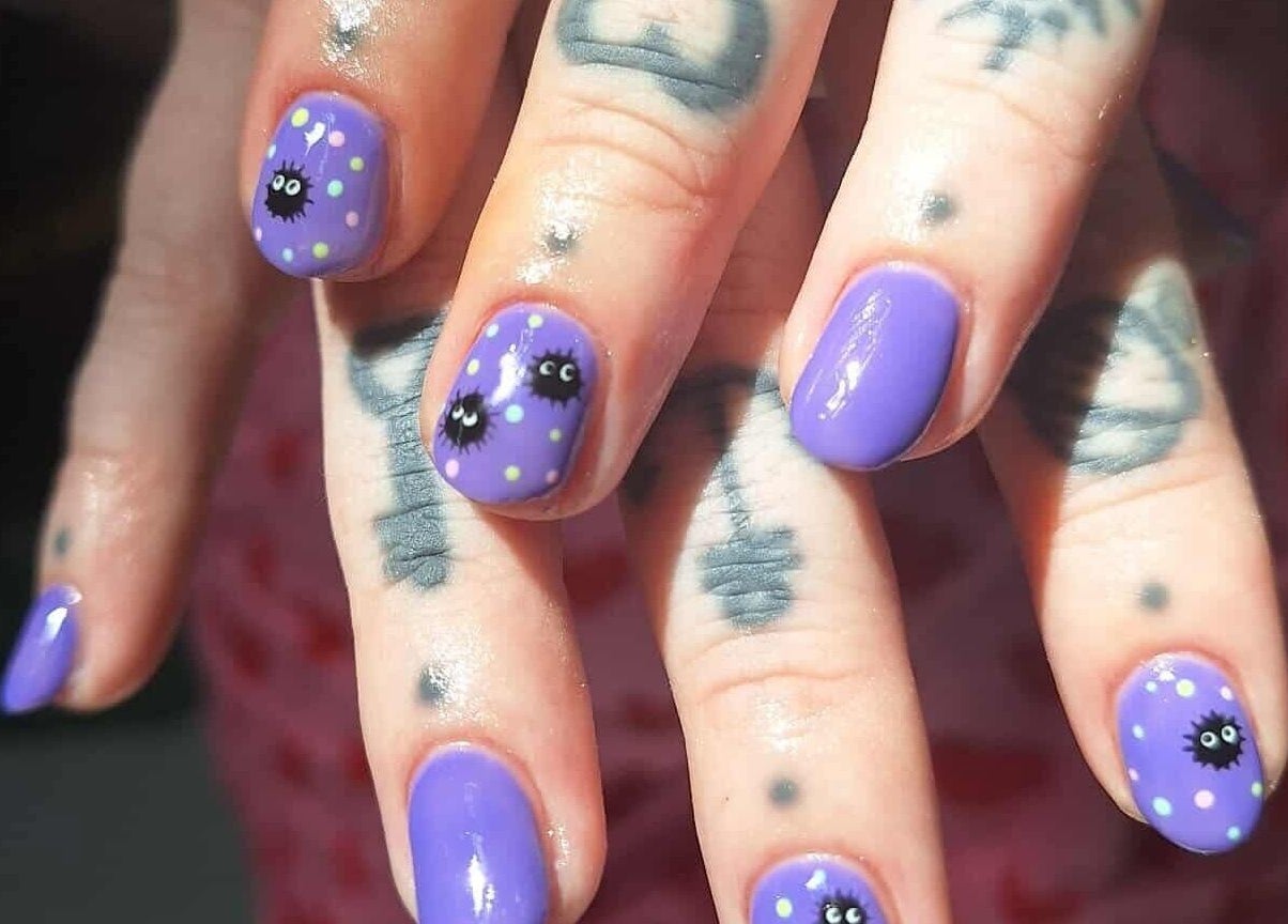 Purple manicure with cute designs at KTF Studios, Cardiff, Wales, GB.