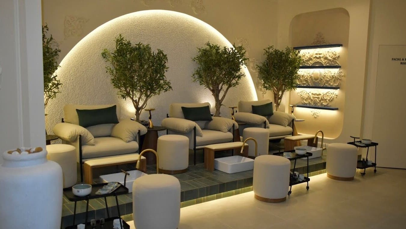 Luxurious seating at Fusion Salon & Spa, Riyadh with elegant decor and lush greenery.