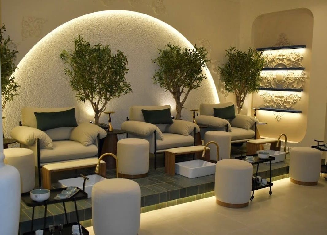 Luxurious seating at Fusion Salon & Spa, Riyadh with elegant decor and lush greenery.