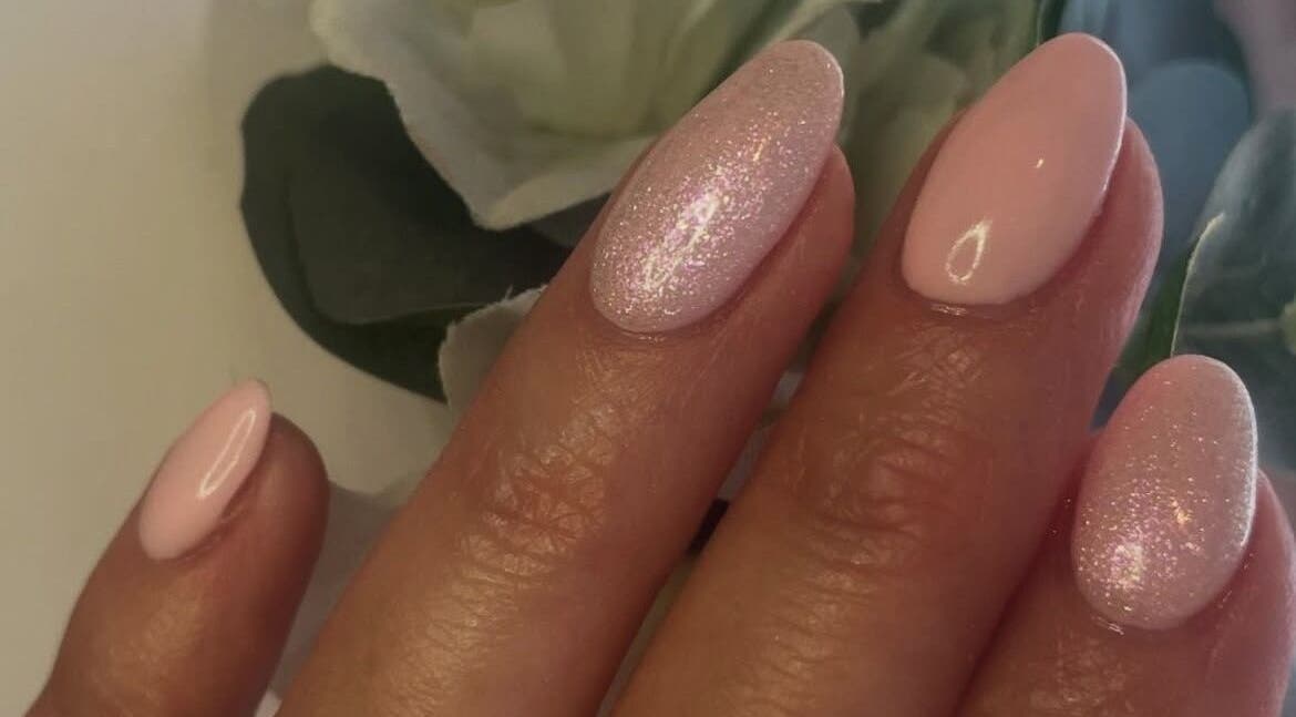 Elegant pink nails with glitter at Vanity Mobile Nails and Beauty by Adele, Nottingham, England, GB.