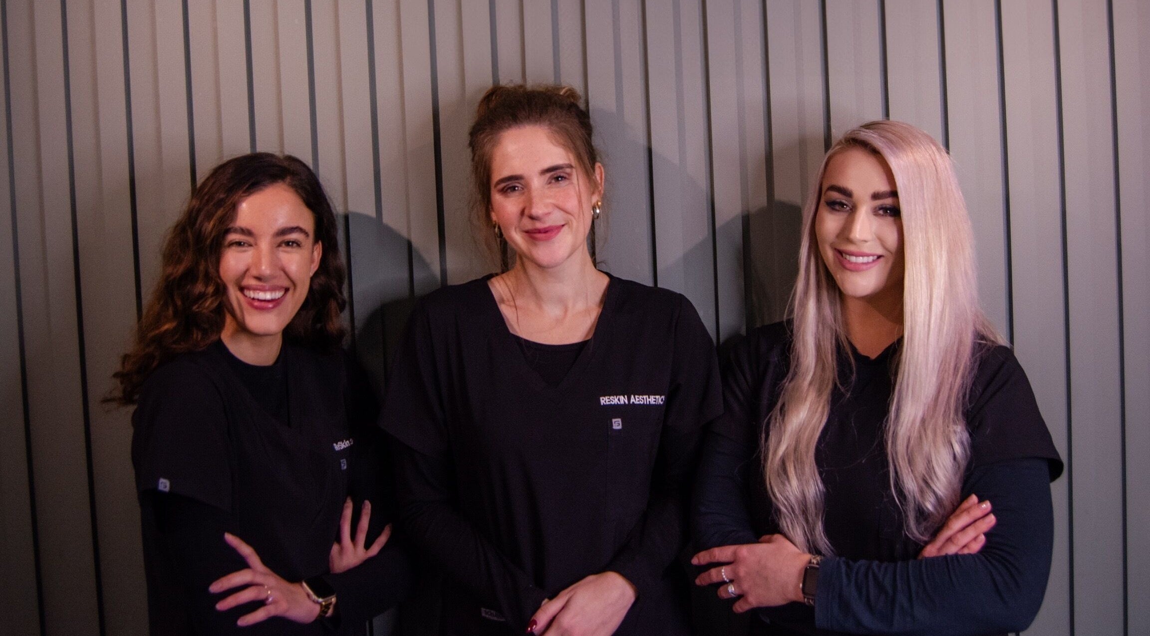 Smiling staff at ReSkin Medical Aesthetic in Paarl, Western Cape, ZA, warmly welcome clients.