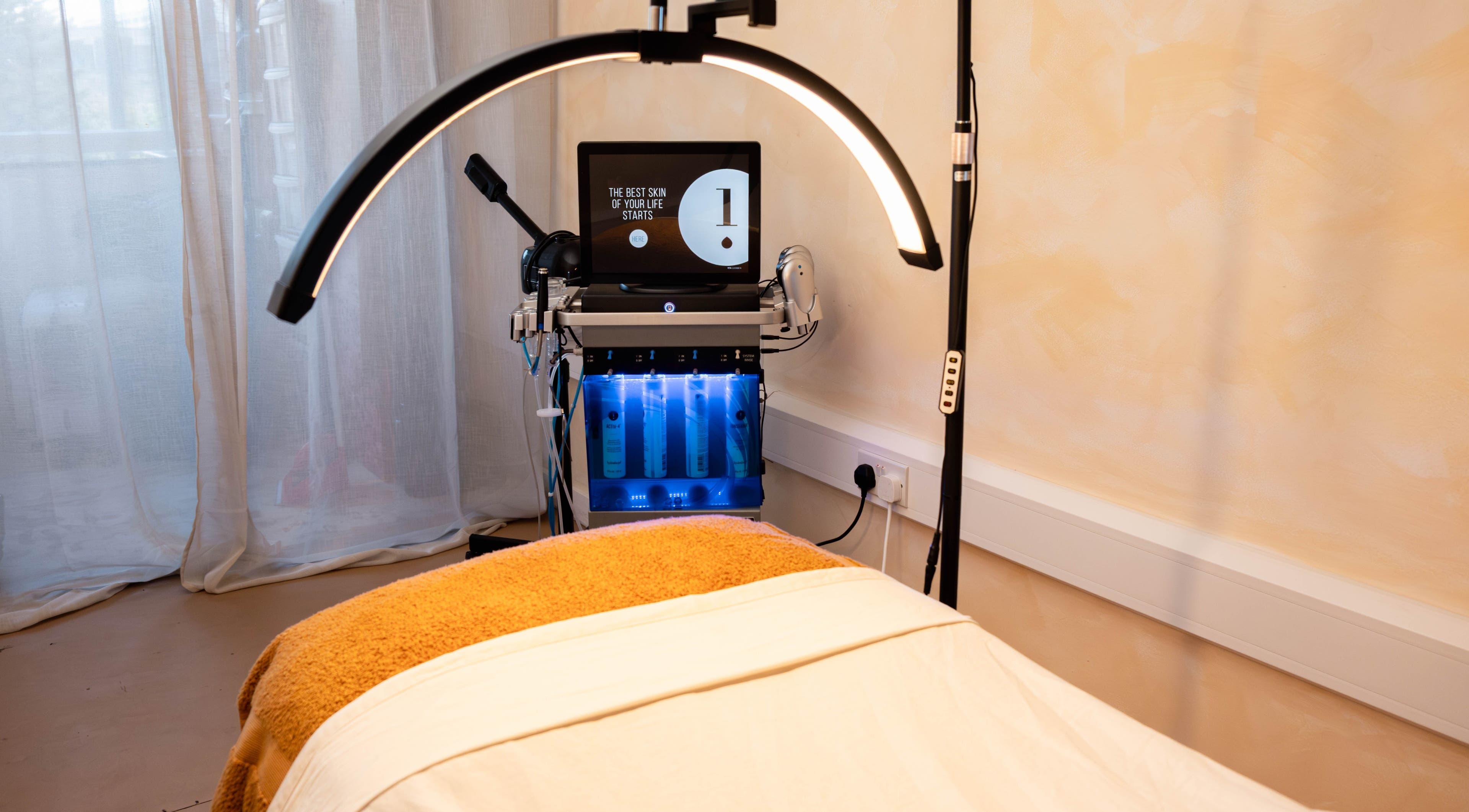 Hydrafacial setup at Deia London, London, England, GB. Luxurious spa treatment room with advanced skincare equipment.