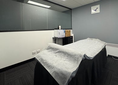 Relaxing wellness room at Body Go Clinic, Melbourne, Victoria, AU featuring a treatment bed and soothing decor.