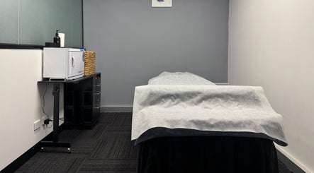 Calm treatment room at Body Go Clinic in Melbourne, Victoria, AU, featuring a massage table and modern decor.