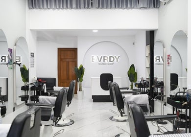Modern interior of EVRDY Barbershop - San Chaung, located in Yangon, Yangon Region, MM, featuring stylish chairs.