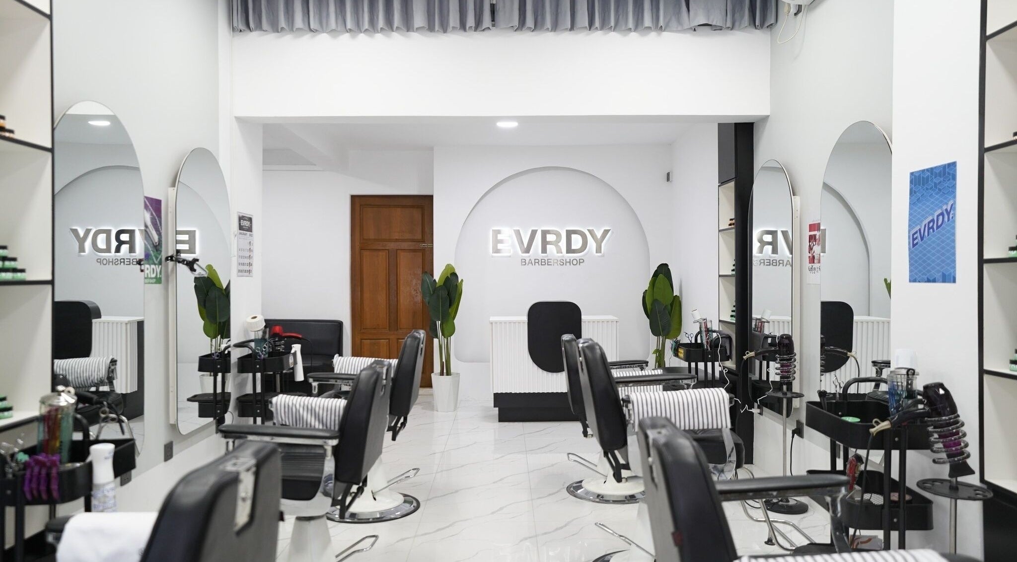 Modern interior of EVRDY Barbershop - San Chaung, located in Yangon, Yangon Region, MM, featuring stylish chairs.