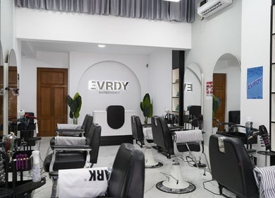 Modern interior of EVRDY Barbershop - San Chaung, located in Yangon, Yangon Region, MM, featuring sleek barber chairs.