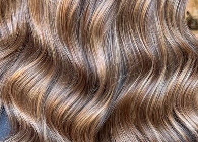 Glossy wavy hair at Grip & Curl salon, Hull, England, GB offers expert styling and hair treatments.