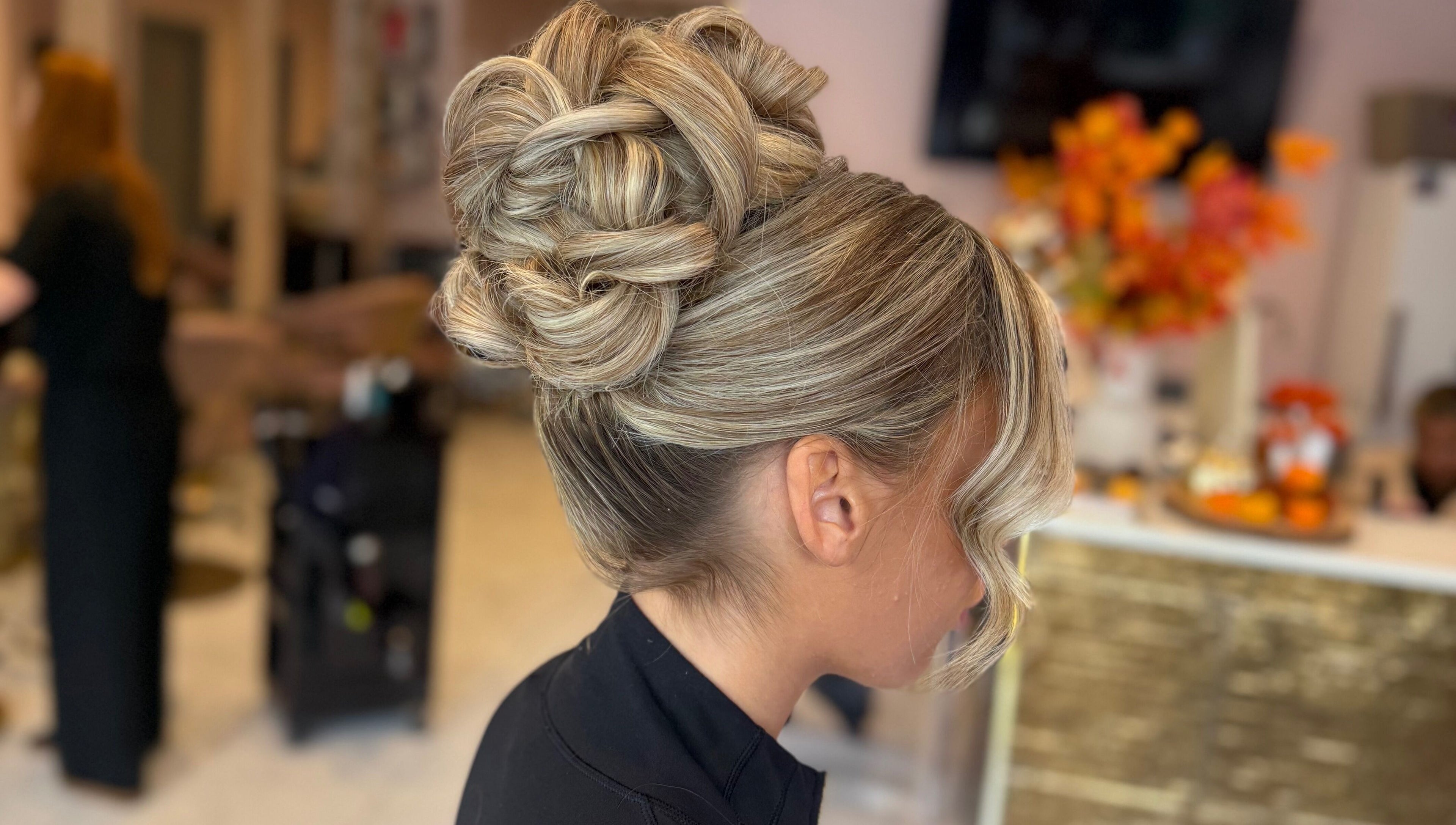 Elegant updo hairstyle at Grip & Curl, Hull, England, GB, showcasing intricate braids and curls.