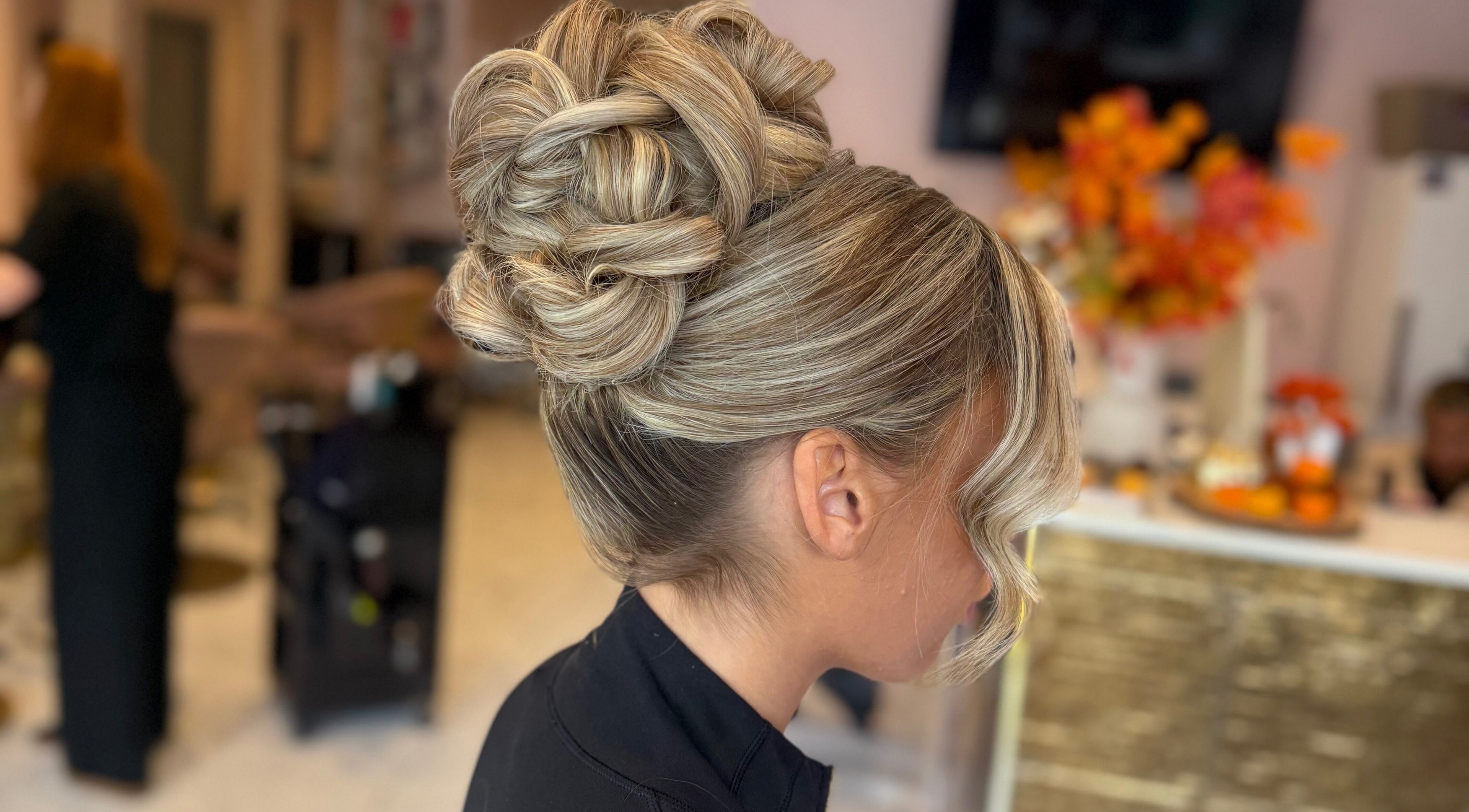 Elegant updo hairstyle at Grip & Curl, Hull, England, GB, showcasing intricate braids and curls.
