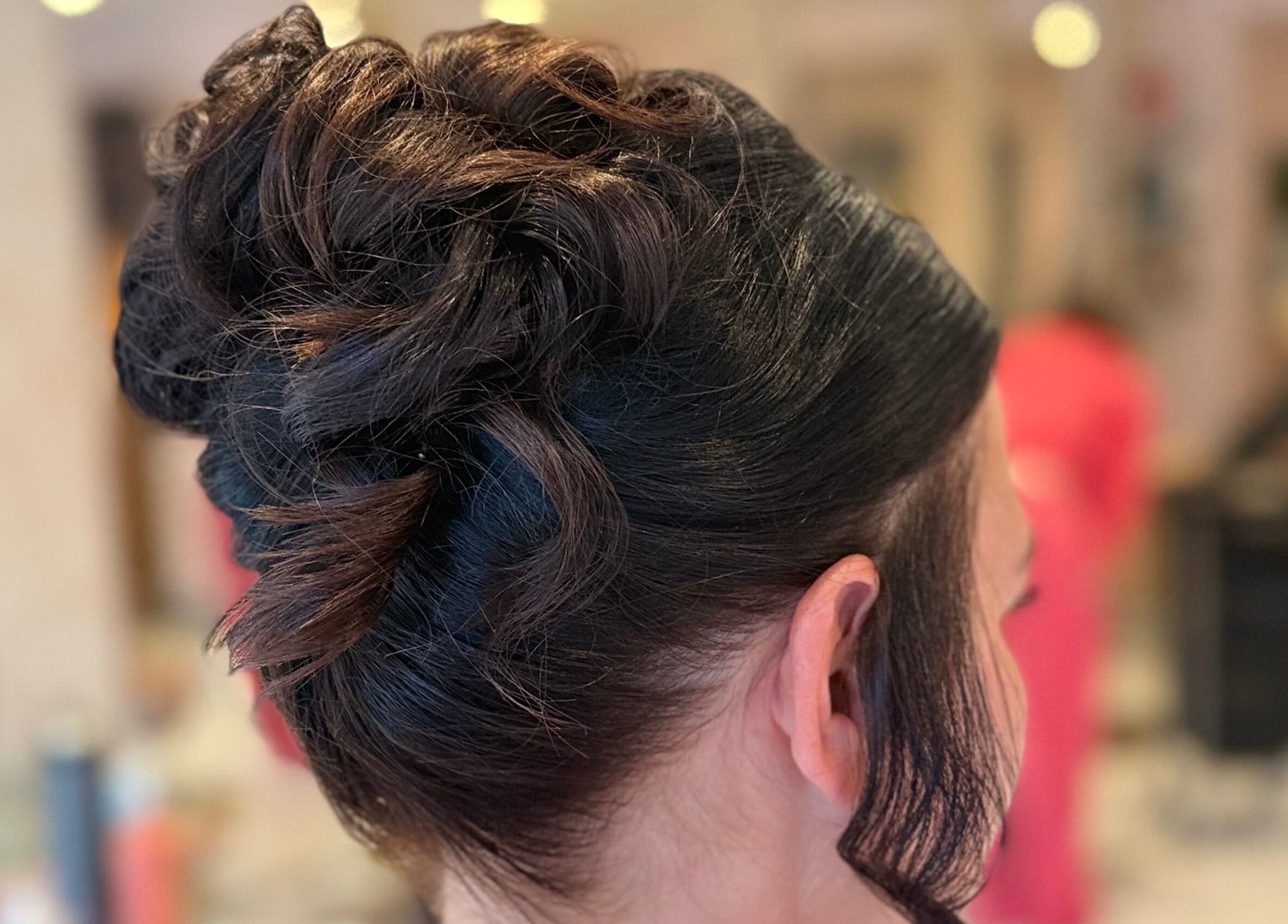 Elegant updo hairstyle at Grip & Curl, Hull, England, GB, showcasing expert styling.