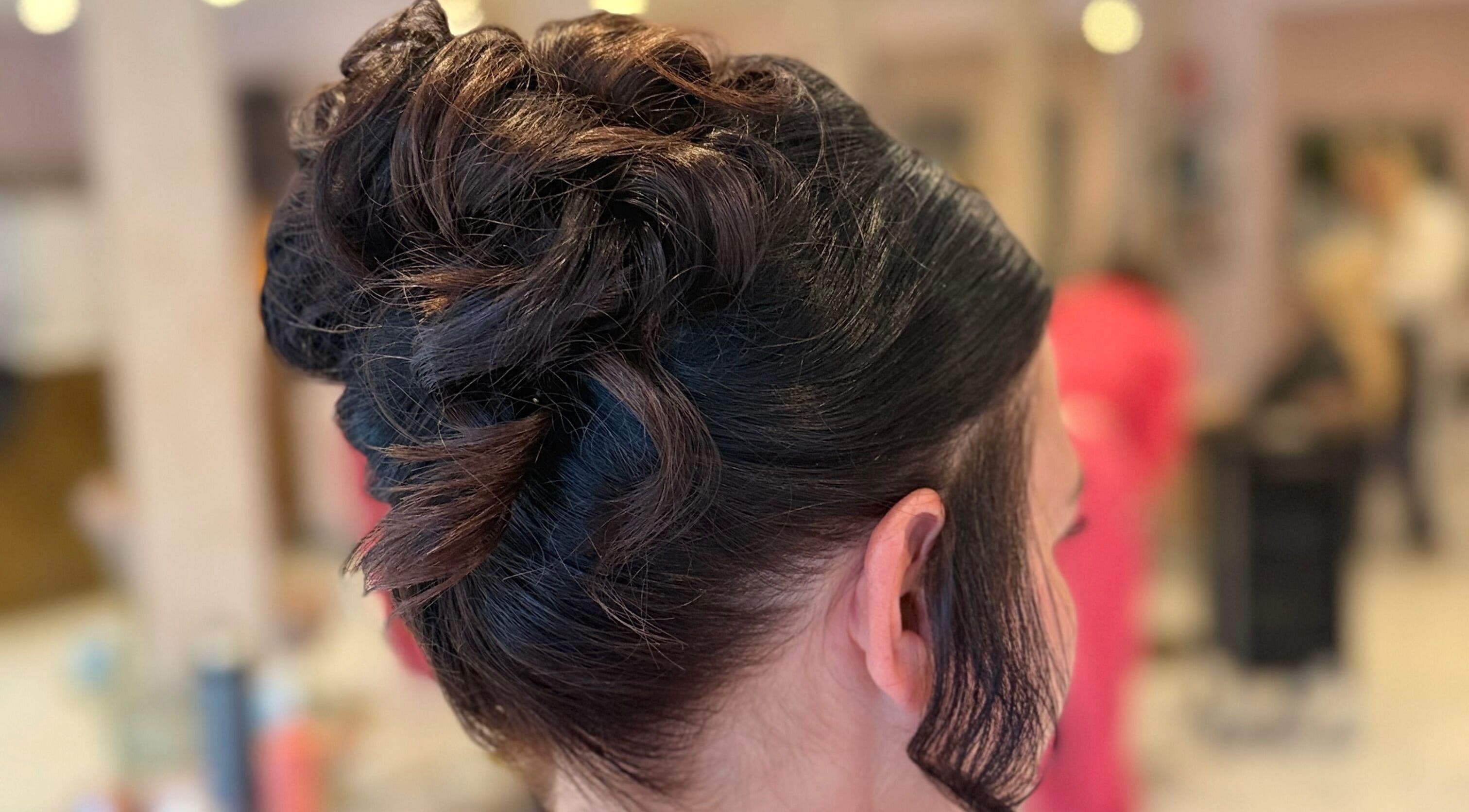 Elegant updo hairstyle at Grip & Curl, Hull, England, GB, showcasing expert styling.