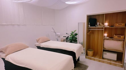 Relaxing double treatment room at Nadesico Beauty & Healing, Singapore, featuring serene decor and soothing atmosphere.