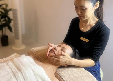 Facial massage at Nadesico Beauty & Healing, Singapore, SG, enhancing relaxation and rejuvenation.