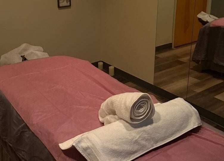 Tranquil massage room with pink sheets at Tropical Touch Columbus LLC, Columbus, Ohio, US.