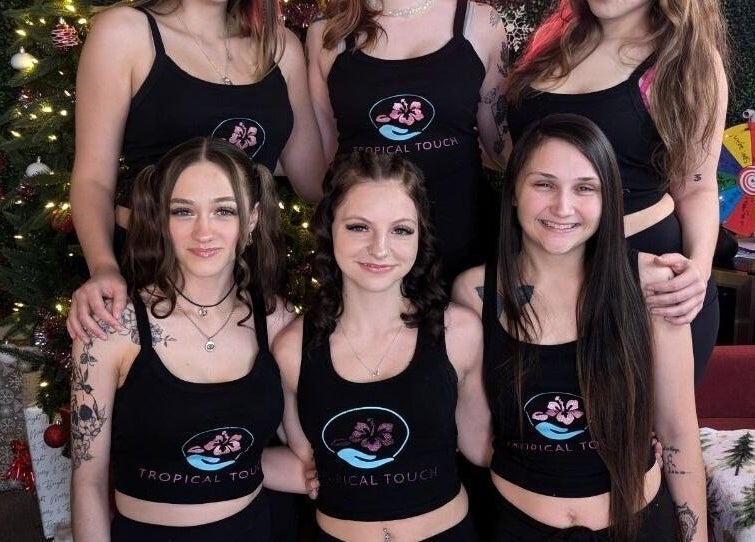 Team members at Tropical Touch Columbus LLC in festive attire in Columbus, Ohio, US.