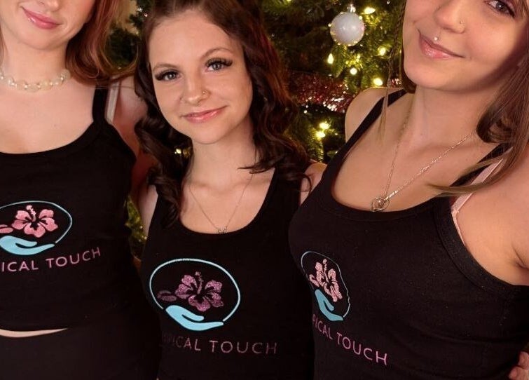 Team members in Tropical Touch shirts smiling at Tropical Touch Columbus LLC, Columbus, Ohio, US.