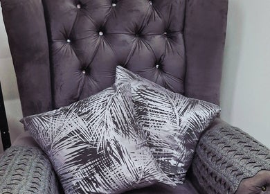 Luxurious chair with cushions at Madelein Nails and Beauty, Pretoria, Gauteng, ZA for ultimate relaxation.