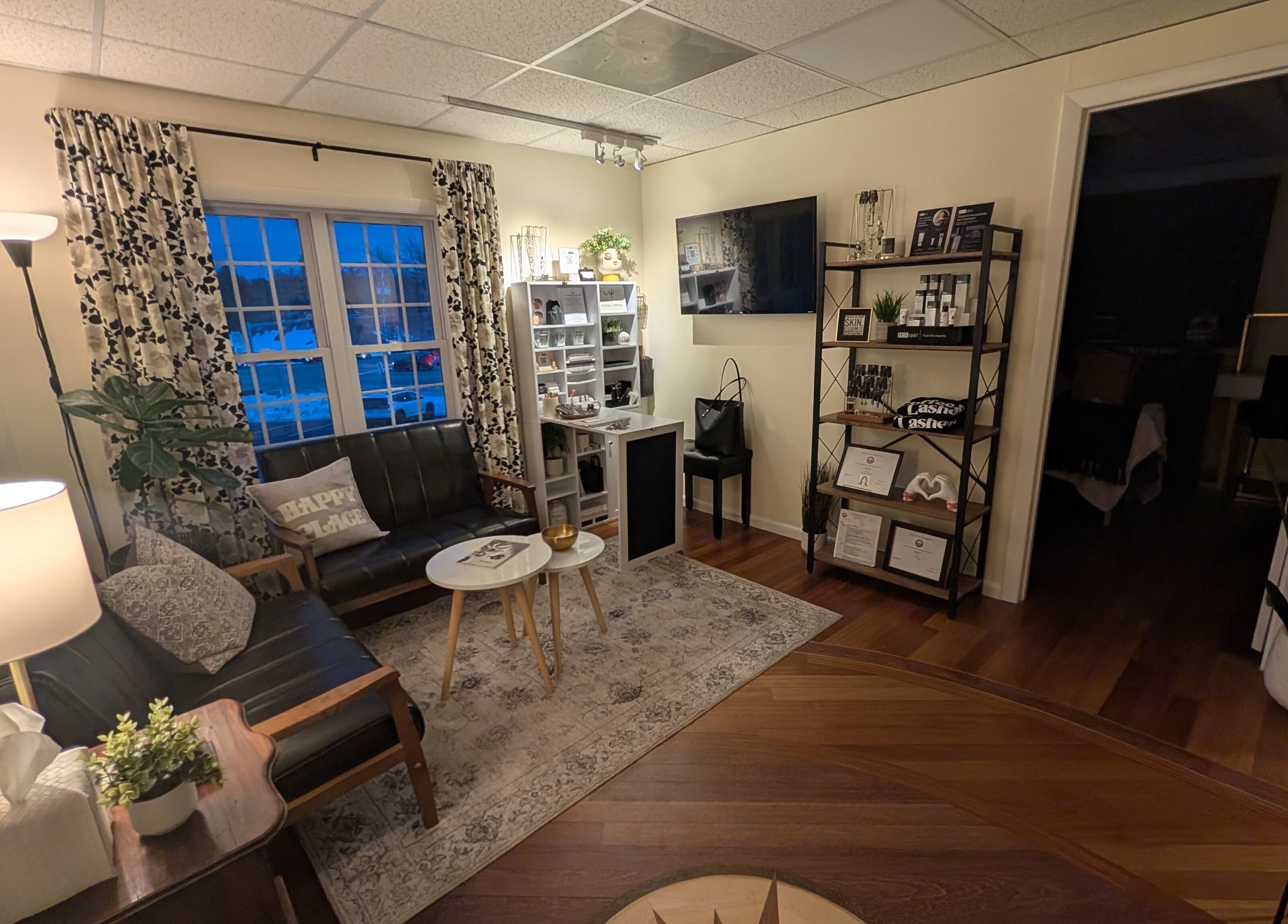 Inviting waiting area at S.L. Skin Studio in Hampstead, New Hampshire, US with cozy seating and stylish decor.