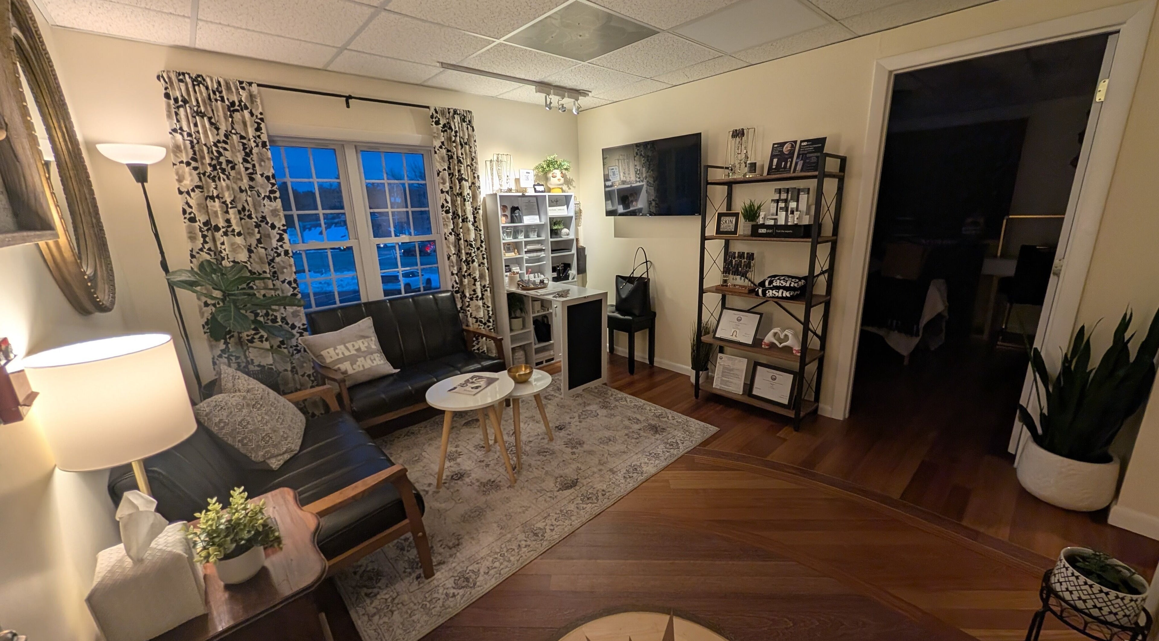 Inviting waiting area at S.L. Skin Studio in Hampstead, New Hampshire, US with cozy seating and stylish decor.