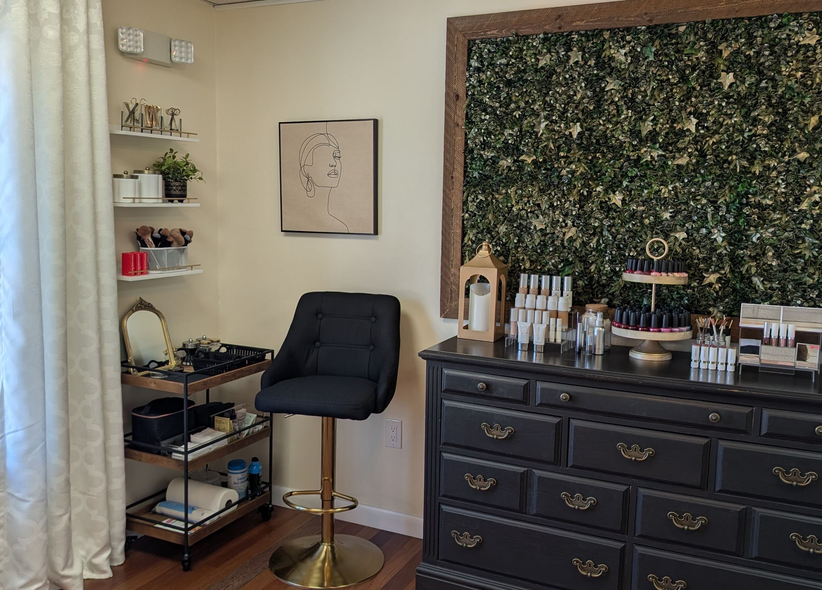Cozy interior of S.L. Skin Studio in Hampstead, New Hampshire, US, featuring beauty products and elegant decor.