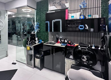 Stylish interior of StavGhair salon in Parkland, Florida featuring modern hairdressing equipment.