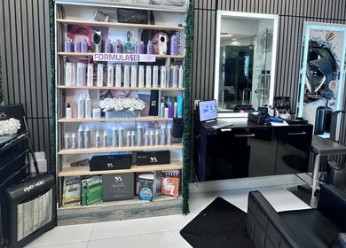 StavGhair beauty salon in Parkland, Florida, showcasing premium haircare products and styling stations.