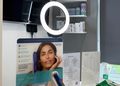 NUYU Body Aesthetics' skincare display in Beckenham, England, featuring SkinPen products under soft lighting.