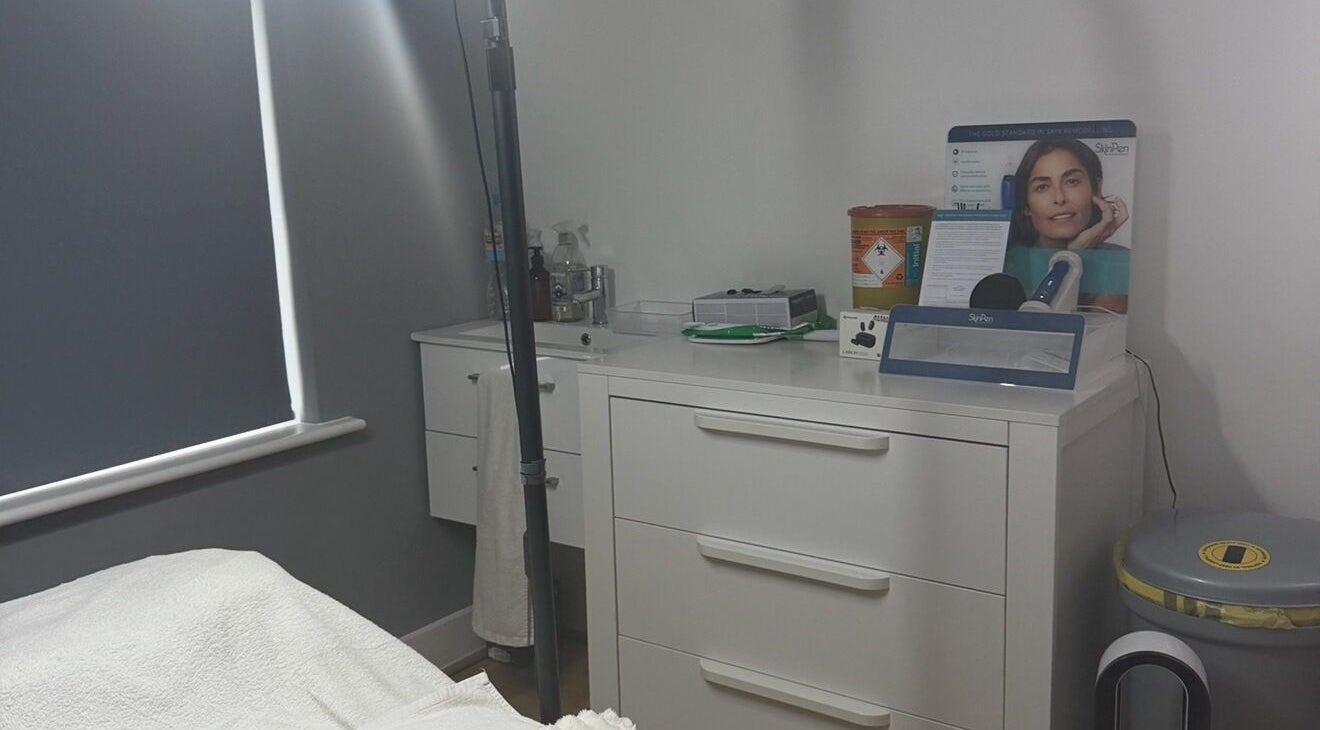Equipment and storage at NUYU Body Aesthetics in Beckenham, England, GB. Clean, calming treatment room.