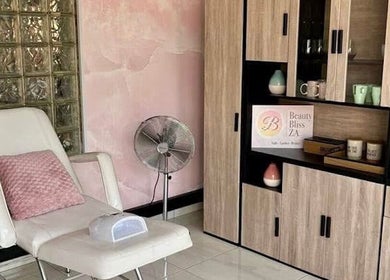 Relaxing beauty room at Beauty Bliss ZA in Pretoria, Gauteng, ZA, featuring a comfy chair and elegant decor.
