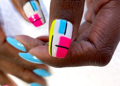 Colorful geometric nails at Beauty Bliss ZA, Pretoria, Gauteng, ZA showcasing vibrant nail art.