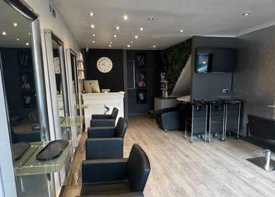 Elegant interior of Florin Bob Hairdressing in Stockport, England, GB with sleek styling stations.