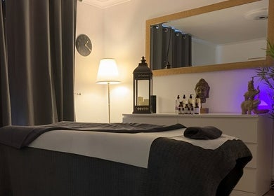 Calm spa room at Florin Bob Hairdressing, Stockport, England, GB. Inviting massage bed and ambient decor.