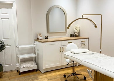 Elegant treatment room at Pure Skin & Aesthetics, Hoveton, England, GB with modern decor and professional setup.