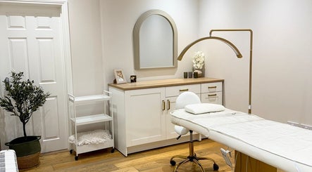 Elegant treatment room at Pure Skin & Aesthetics, Hoveton, England, GB with modern decor and professional setup.