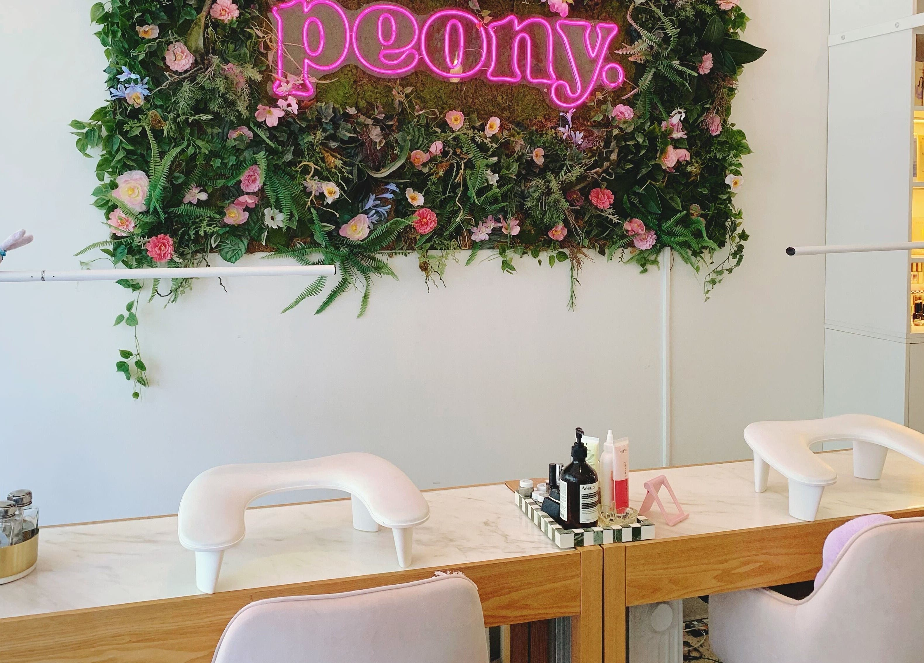 Stylish nail station at Peony Beauty Melbourne, Prahran, Victoria, AU with lush floral decor.