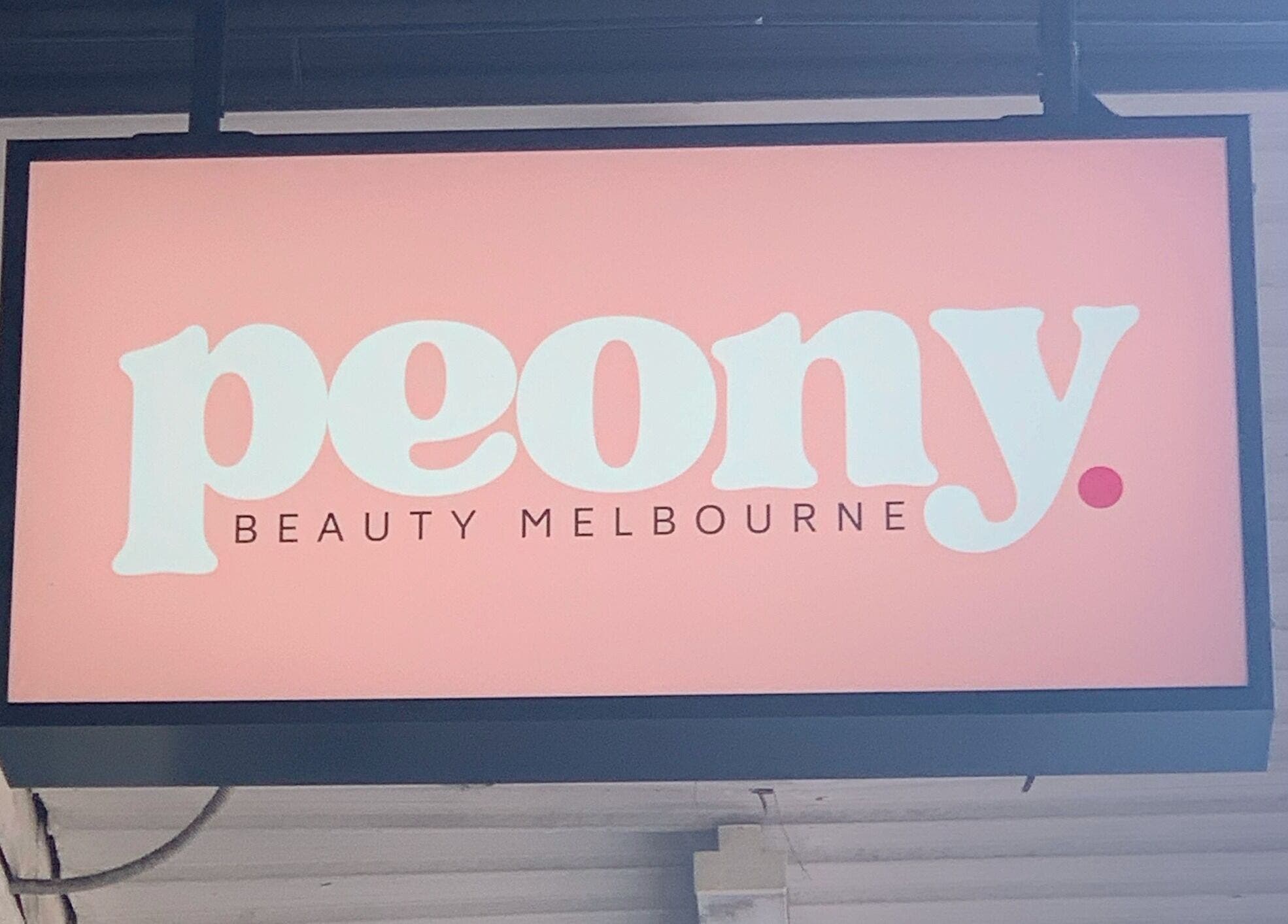 Peony Beauty Melbourne storefront sign in Prahran, Victoria, AU, with chic pink branding.