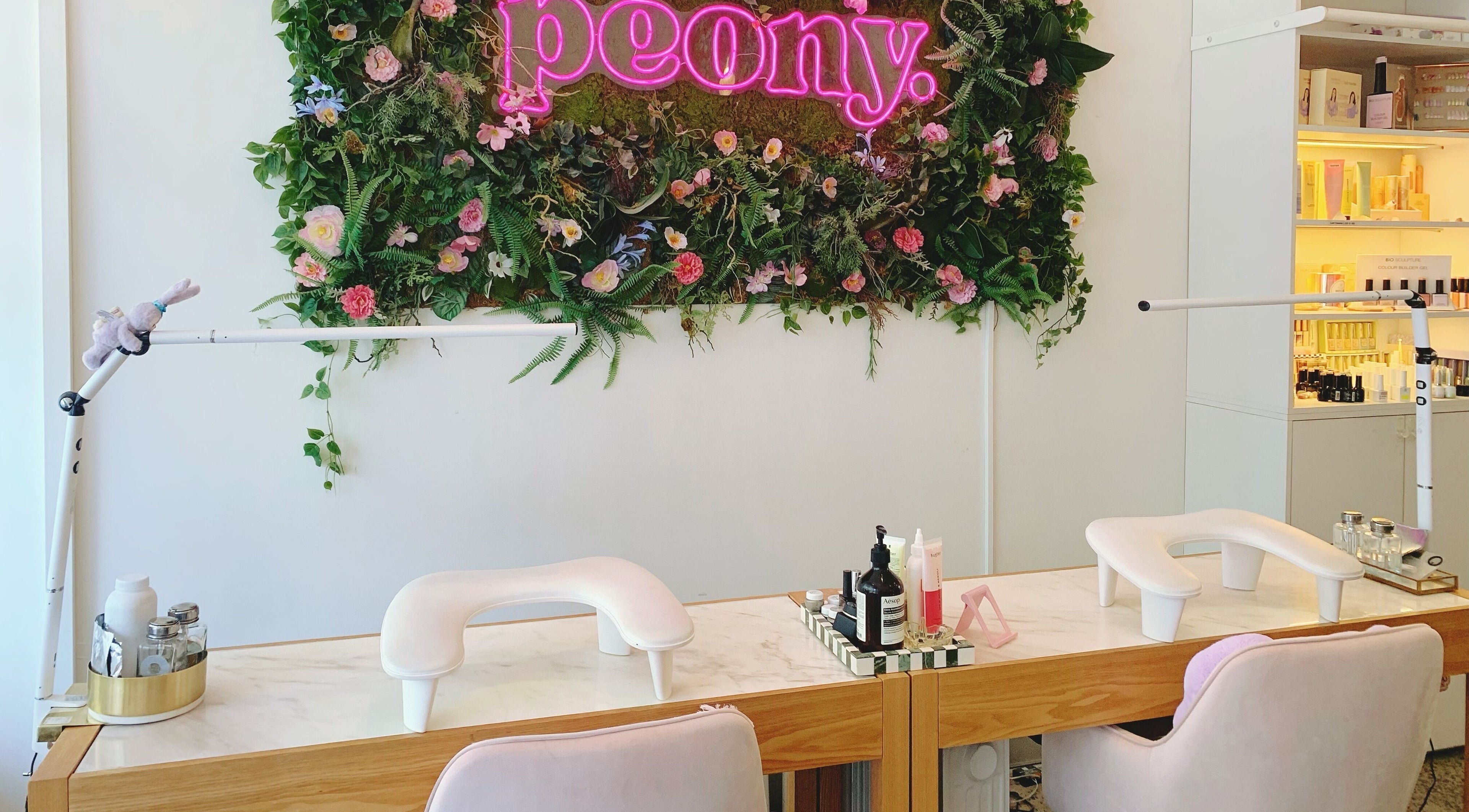 Nail station at Peony Beauty Melbourne, adorned with floral decor, in Prahran, Victoria, AU.