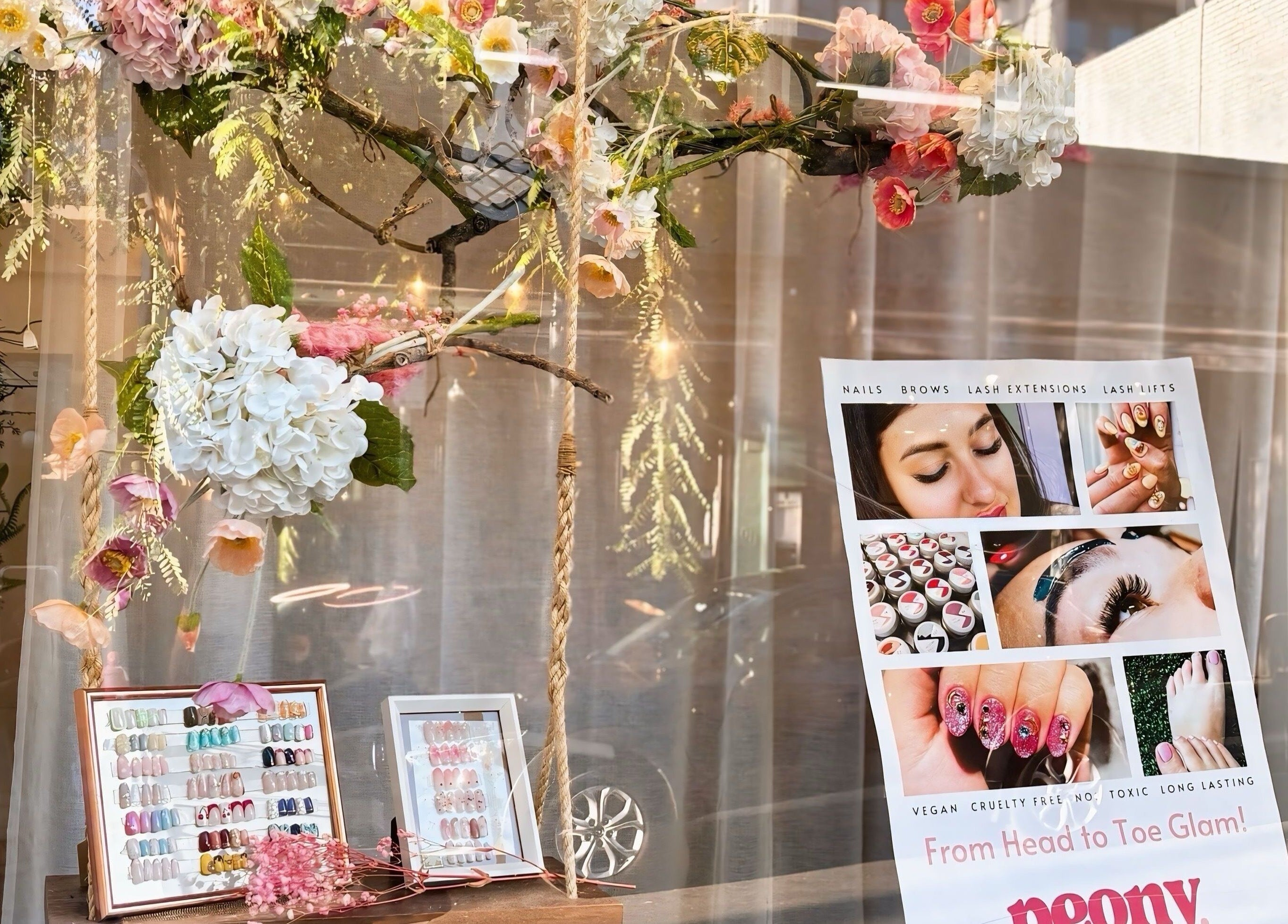 Chic floral-themed window display at Peony Beauty Melbourne, Prahran, Victoria, AU, showcasing beauty services.