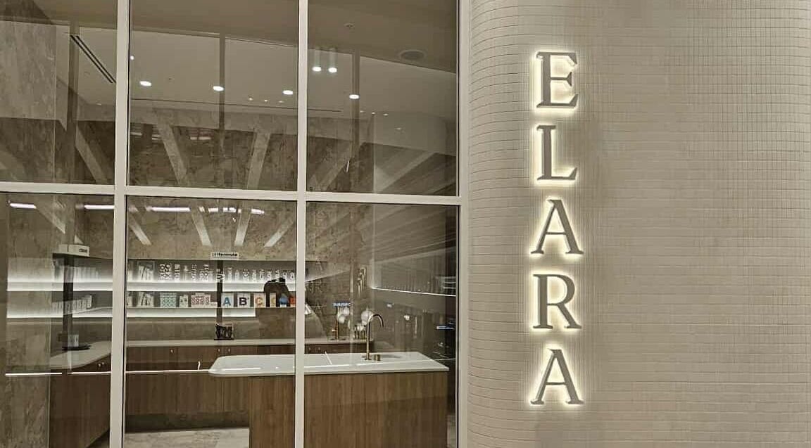 Modern reception area of Elara in Glenside, South Australia with elegant decor and illuminated name sign.