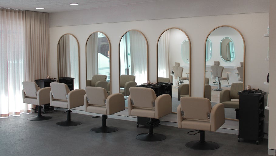 Modern salon chairs and mirrors at The Gym, Mile End, South Australia, AU offer a stylish, welcoming ambiance.