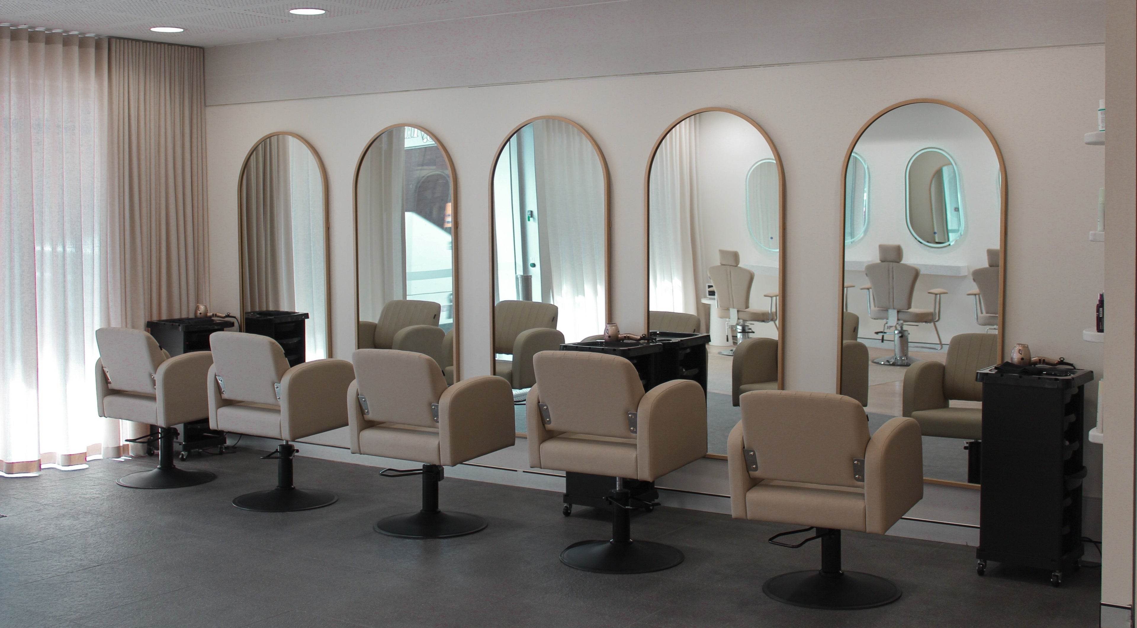 Modern salon chairs and mirrors at The Gym, Mile End, South Australia, AU offer a stylish, welcoming ambiance.