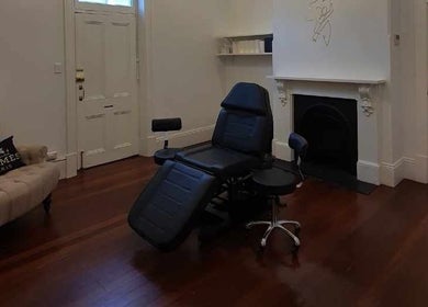 Chic room at The Gym, Mile End, South Australia, AU with modern recliner and cozy seating.