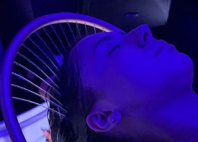 Person relaxing under unique blue lighting at The Gym, Mile End, South Australia, AU.