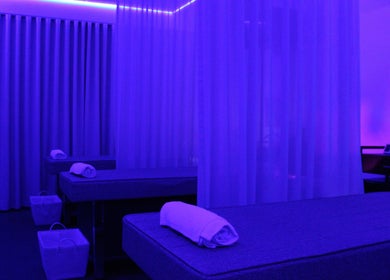 Relaxing massage room at The Gym, Mile End, South Australia, AU with dim lighting and massage tables.