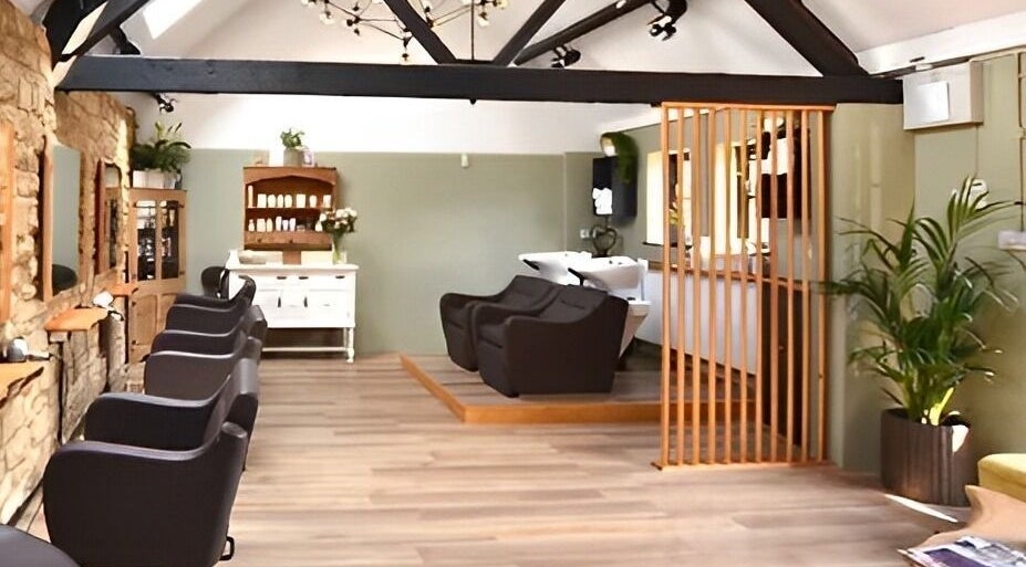 Elegant interior of The Hair Loft in Stoke-sub-Hamdon, England, GB with stylish chairs and modern decor.