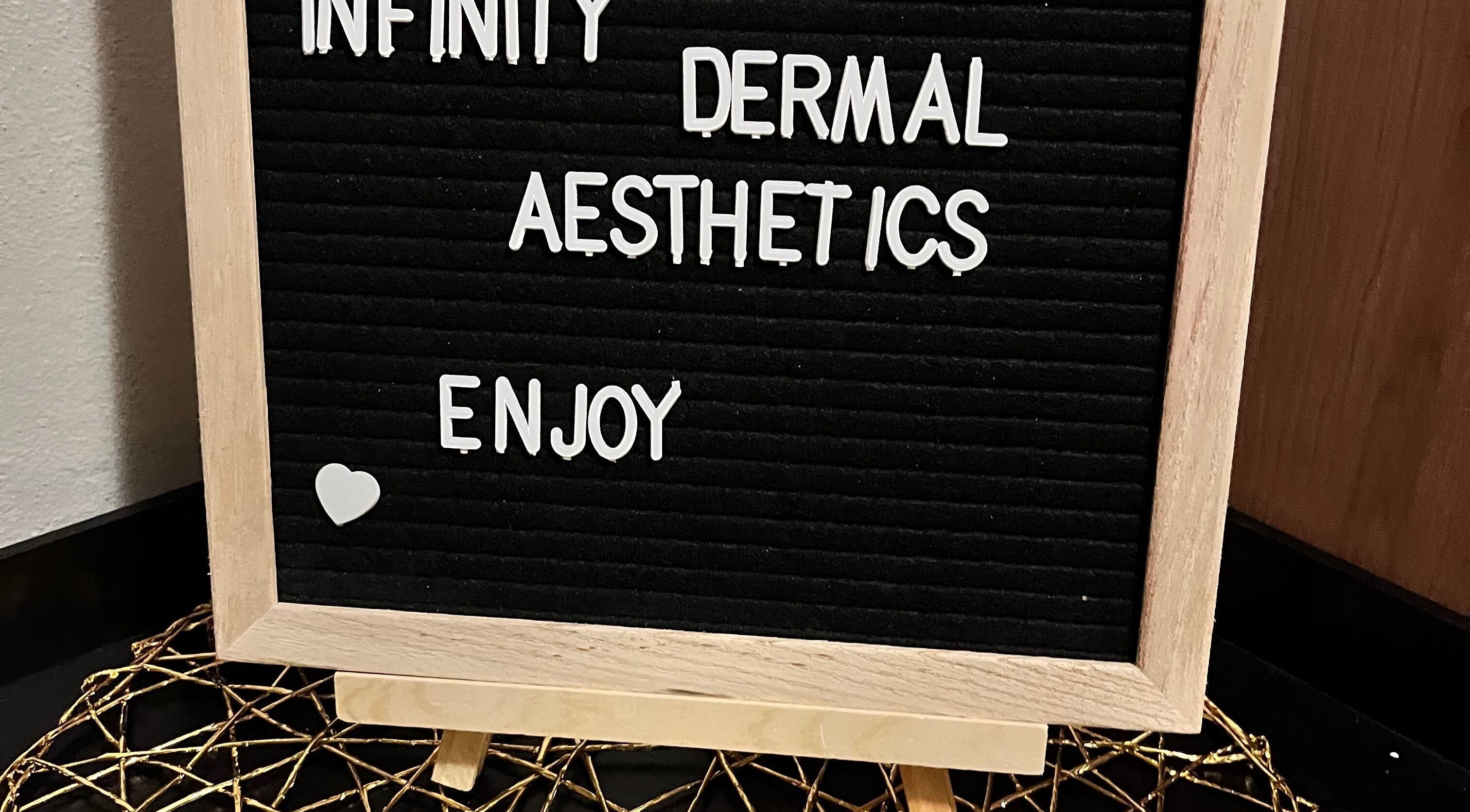 Welcome sign for Infinity Dermal Aesthetics in Johannesburg, Gauteng, ZA, emphasizing enjoyment and care.