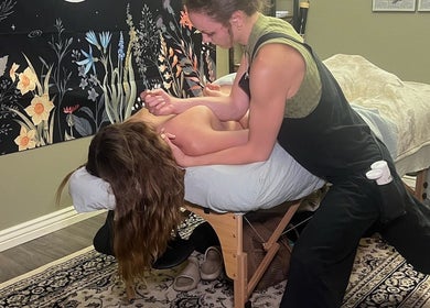 Massage therapist at Blissful Balance in Orem, Utah giving relaxing treatment in a tranquil setting.
