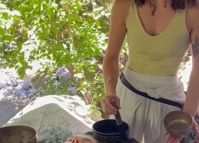 Outdoor sound healing at Blissful Balance in Orem, Utah, US, amid tranquil, leafy surroundings.