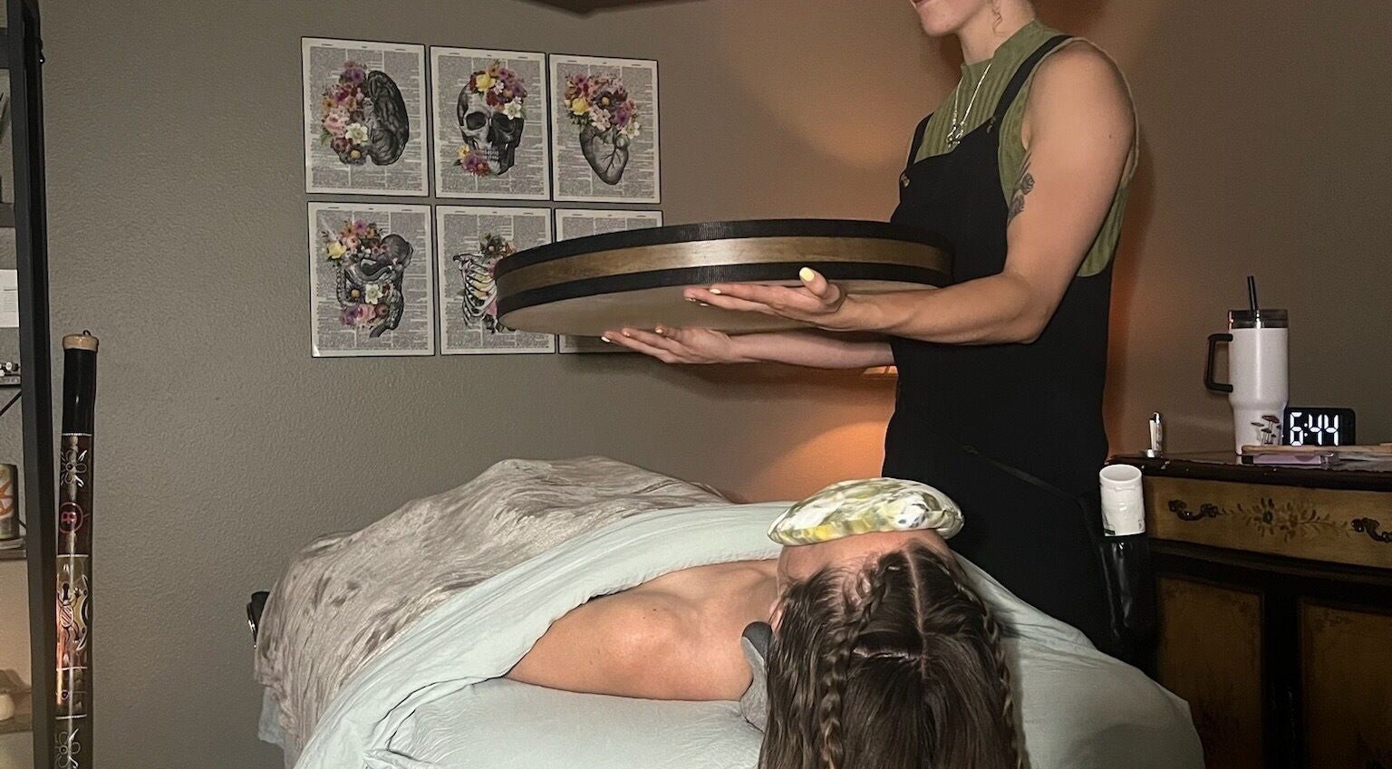 Practitioner using sound therapy at Blissful Balance, Orem, Utah, US, enhancing relaxation and wellness.